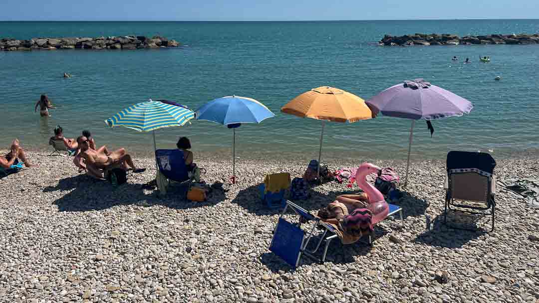 le marche italy Baywatch beach sun umbrellas 