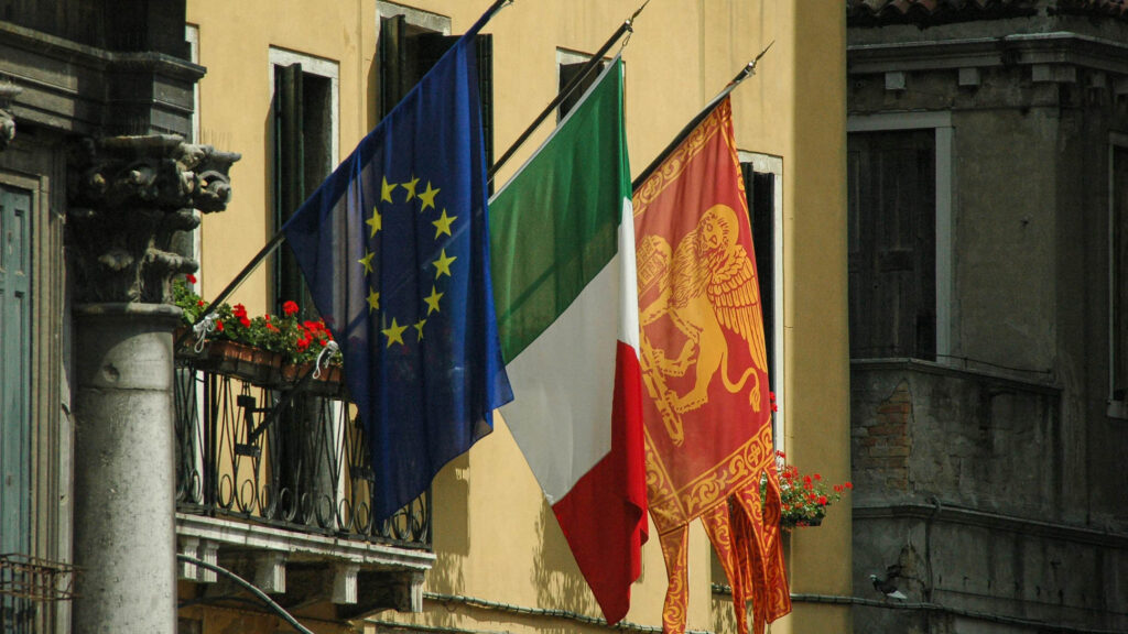 The european flag, the Italian flag and the San Marco flag