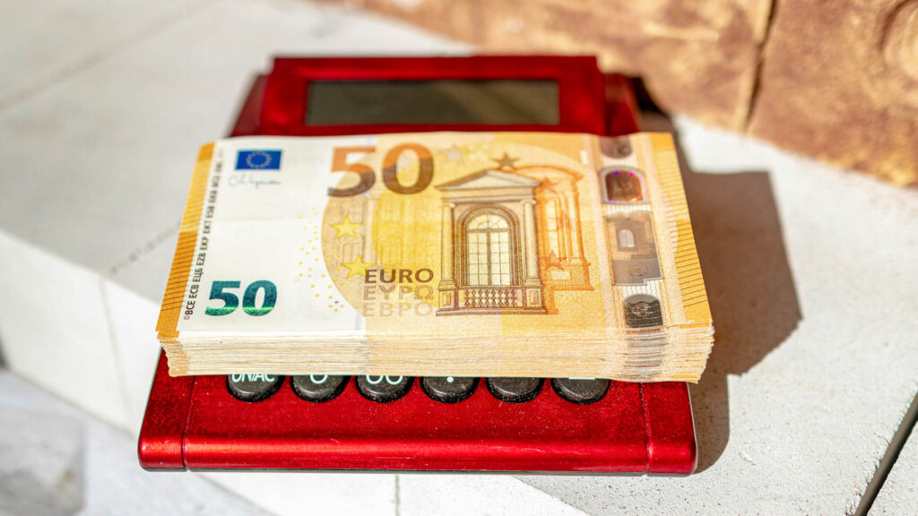 50 euro notes on top of a calculator