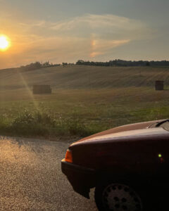 detail of a moving car at sunset in Italy