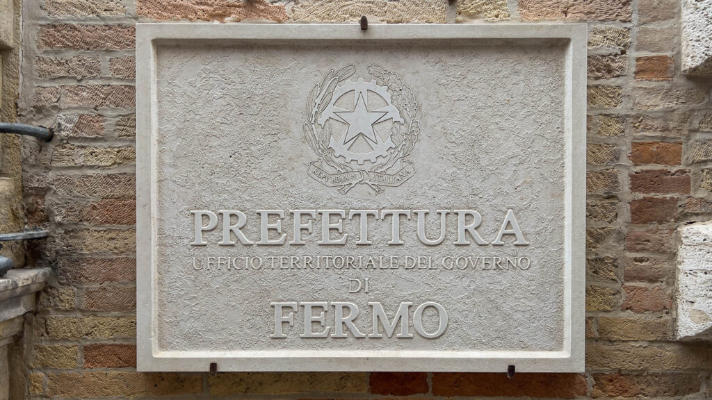 Wall sign from the Questura in Fermo, Italy 