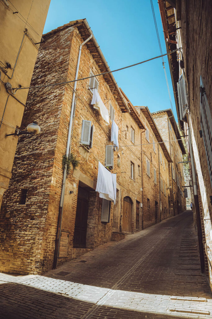 steep street inside the old town, laundry hanging from windows