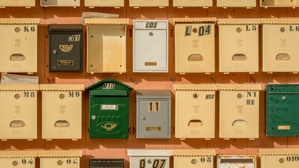 Coloured Letterboxes on a wall 