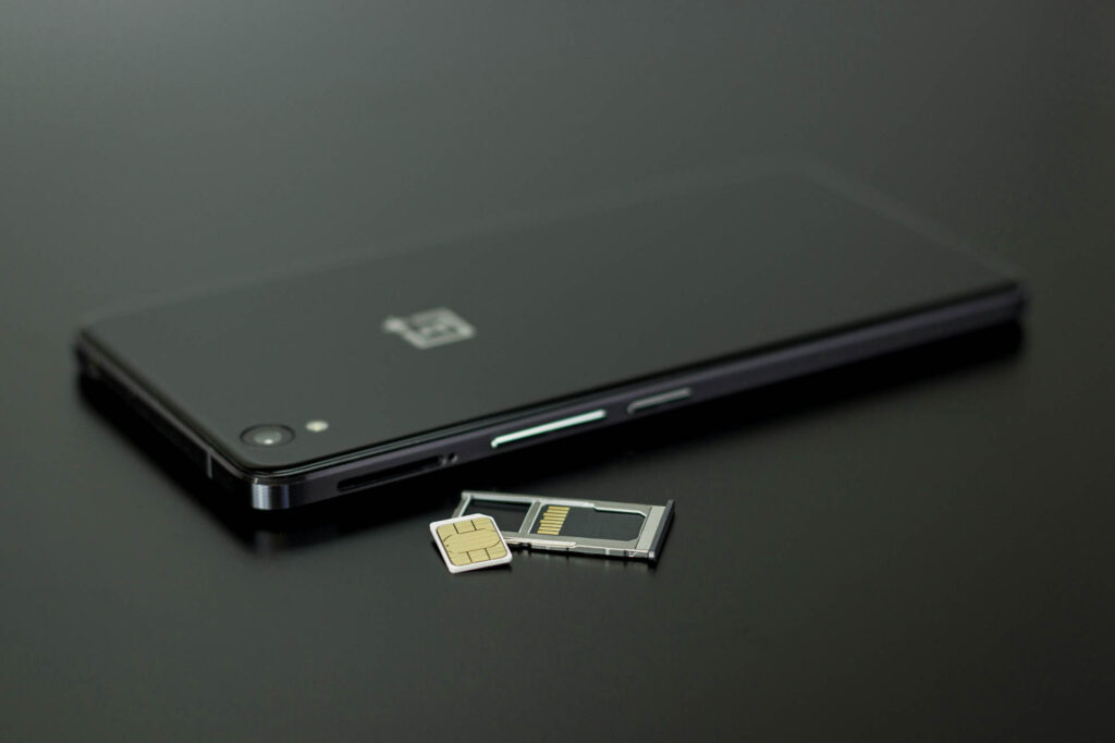 Black smartphone on a black background 